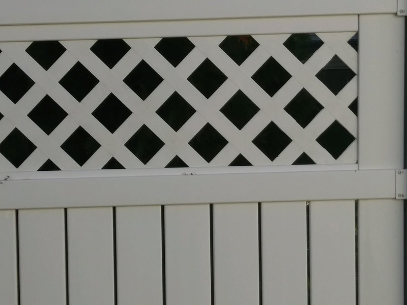 Close up of clean fence after power washing